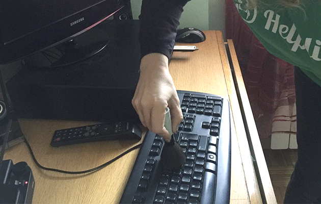 Person Dusting their Keyboard